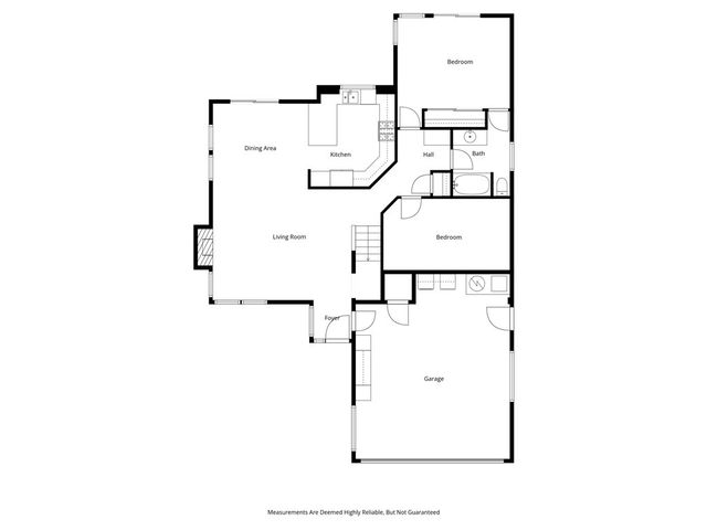 an aerial view of a house with a garden