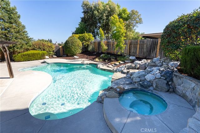 an empty room with closet and windows