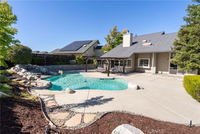 a bathroom with a sink a toilet a mirror a vanity and shower