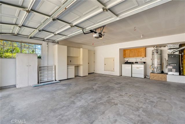 a swimming pool with outdoor seating and yard