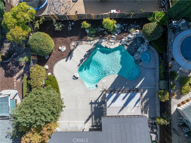 a view of a patio with a table and chairs
