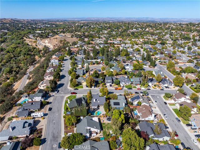 an aerial view of a house yard and outdoor seating