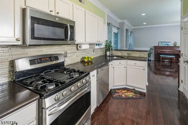 a kitchen with a stove and a microwave