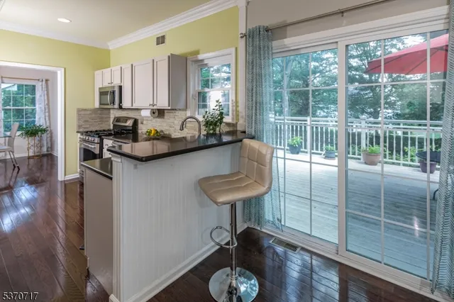 a kitchen with sink and window