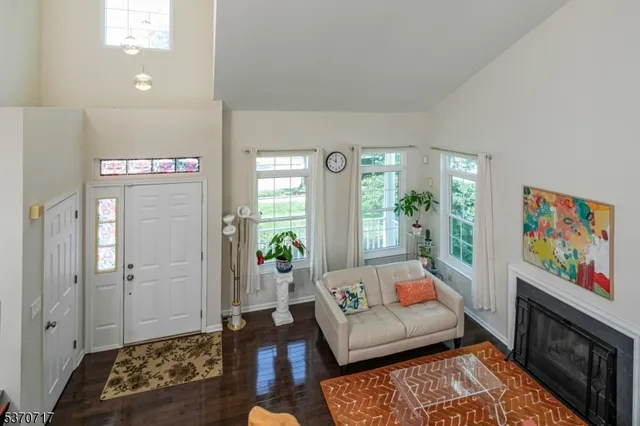 a living room with furniture and a rug