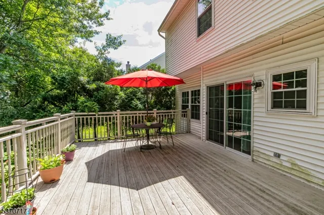 a view of balcony with a patio and wooden deck