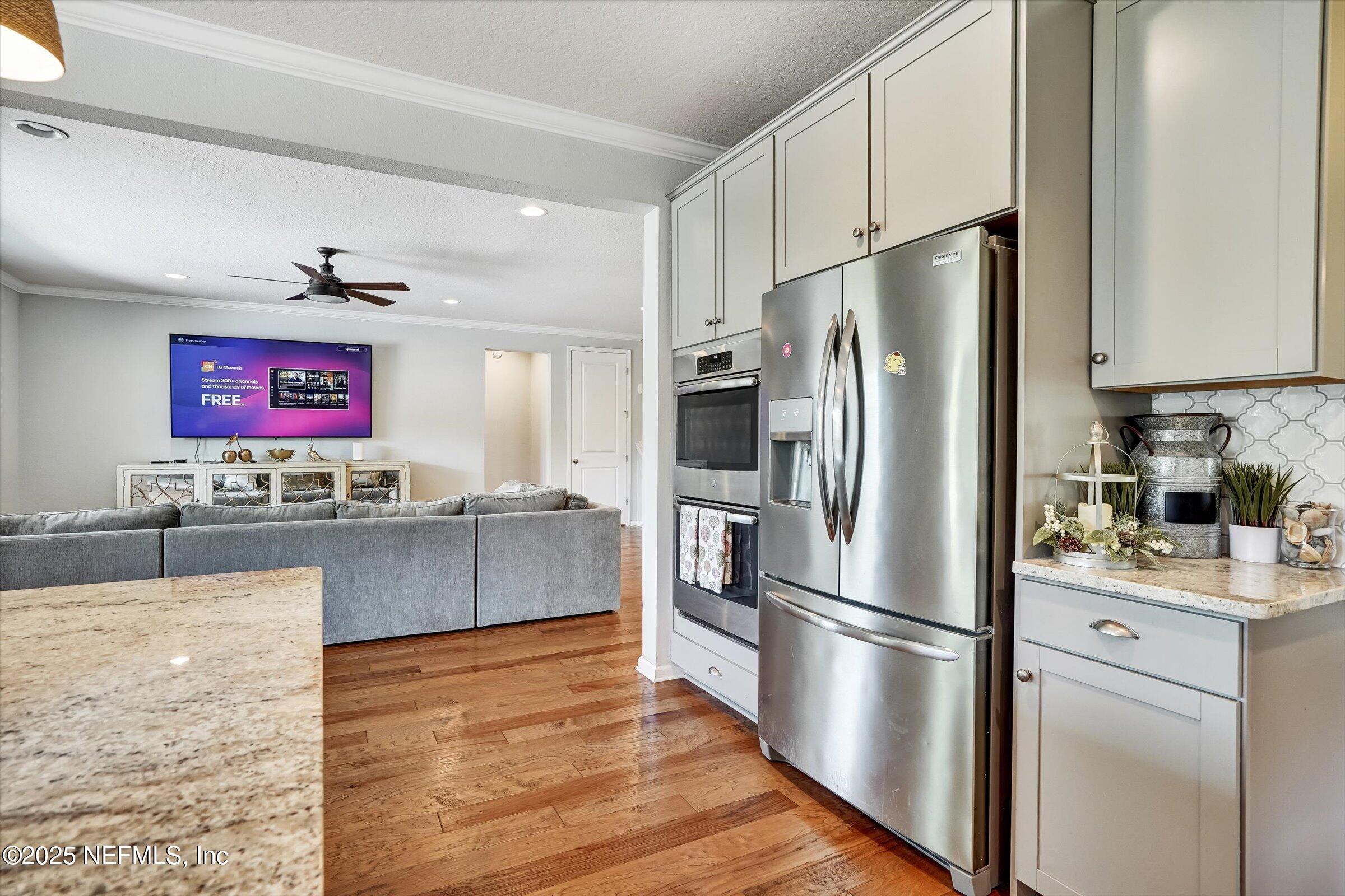 410 Downs Corner Road St. Augustine, FL 32092 - Photo 13 of 45 a kitchen with stainless steel appliances granite countertop a refrigerator sink and stove