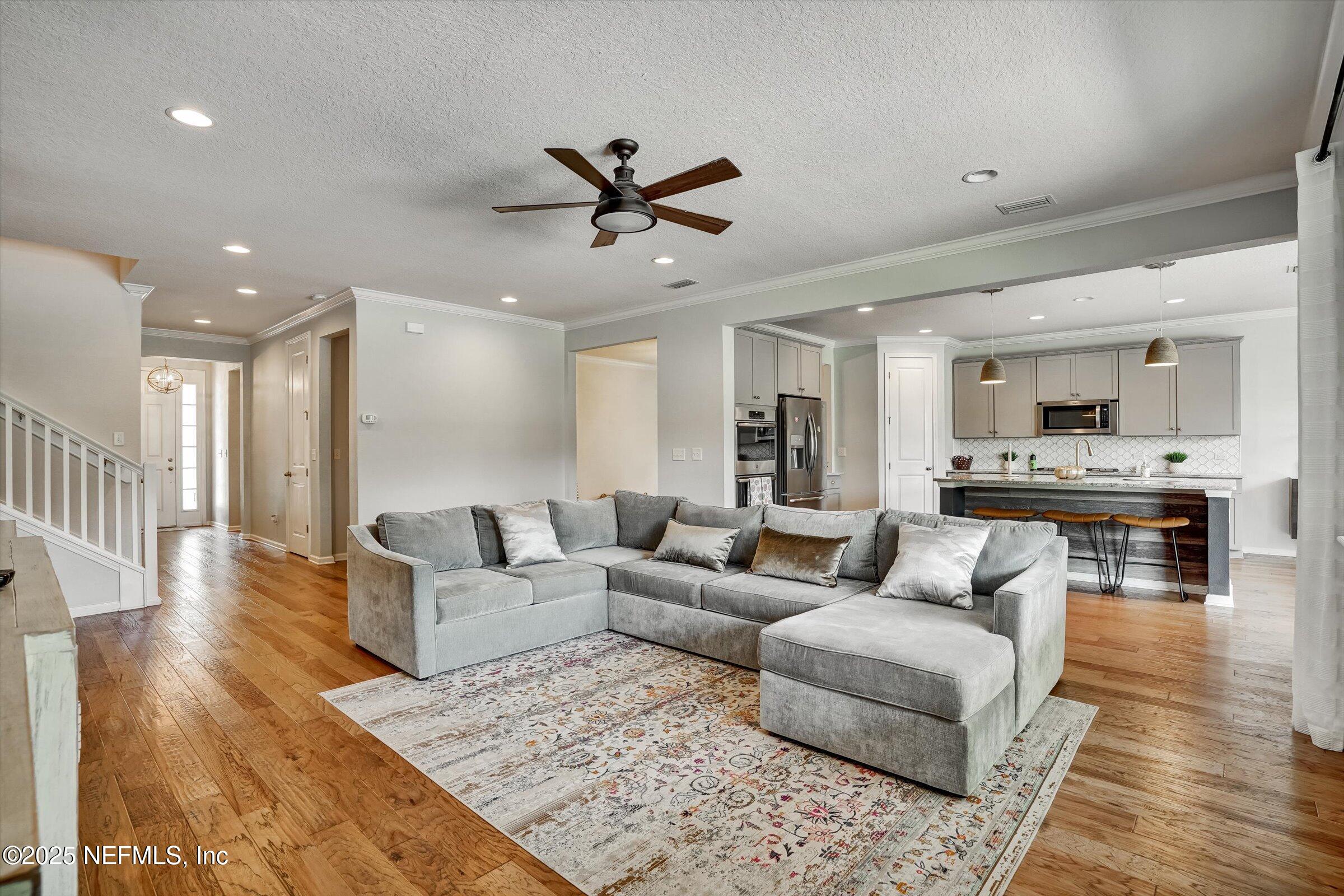 410 Downs Corner Road St. Augustine, FL 32092 - Photo 19 of 45 a living room with furniture and kitchen view
