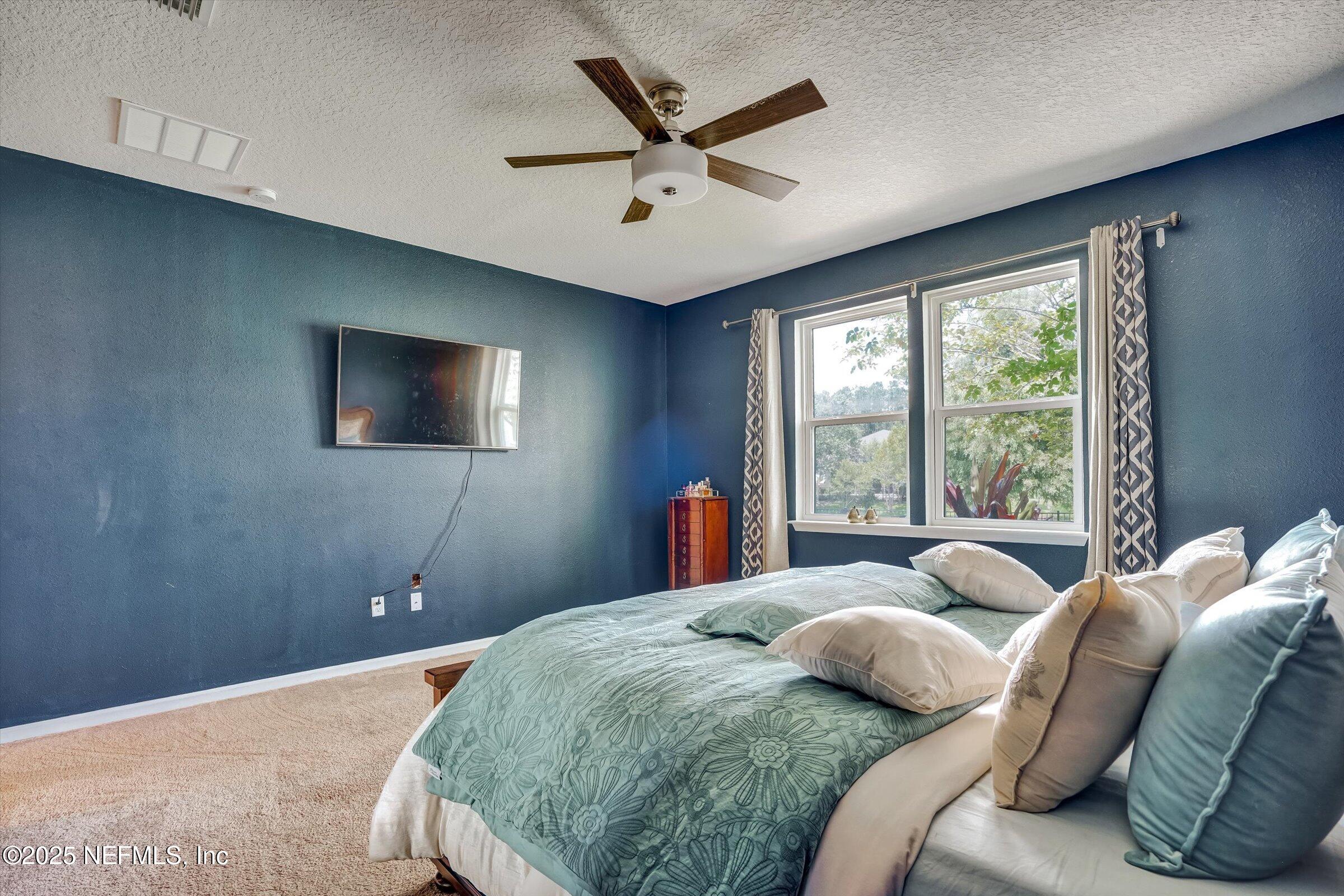 410 Downs Corner Road St. Augustine, FL 32092 - Photo 28 of 45 a bedroom with a bed and window