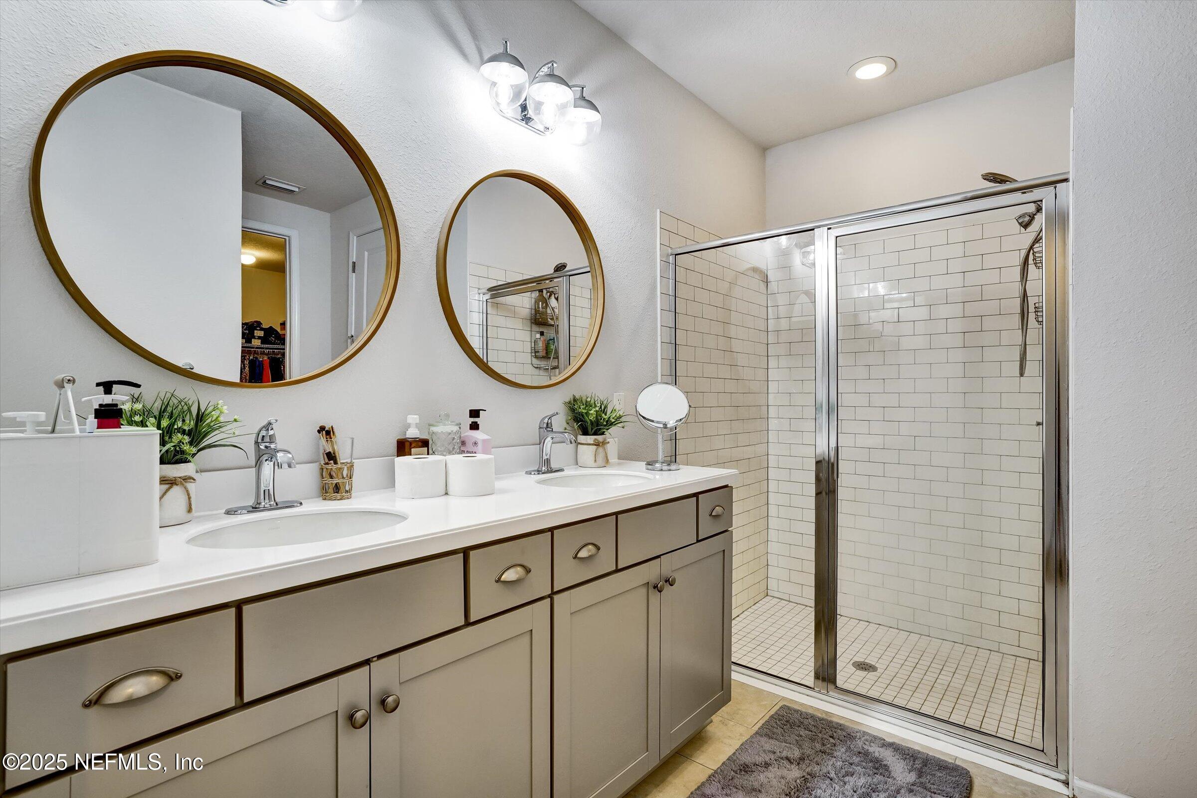 410 Downs Corner Road St. Augustine, FL 32092 - Photo 32 of 45 a bathroom with a sink and a mirror