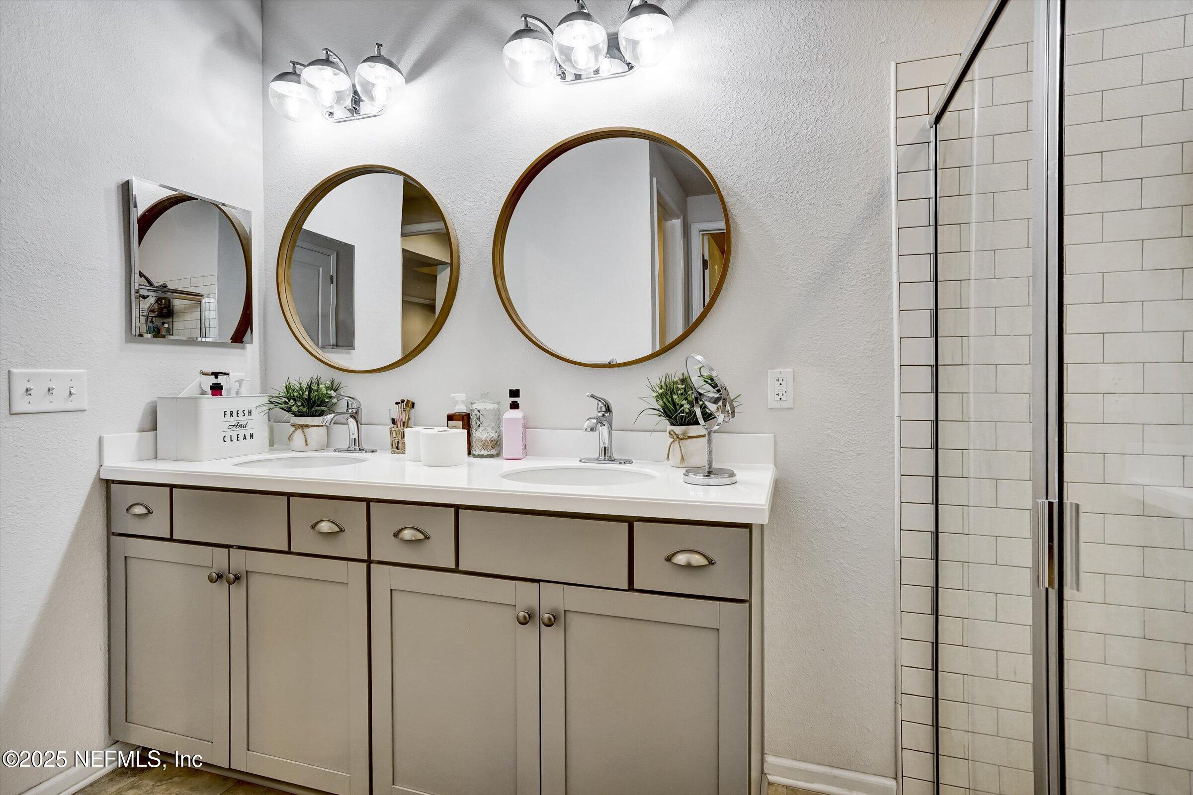 410 Downs Corner Road St. Augustine, FL 32092 - Photo 33 of 45 a bathroom with a sink and a mirror