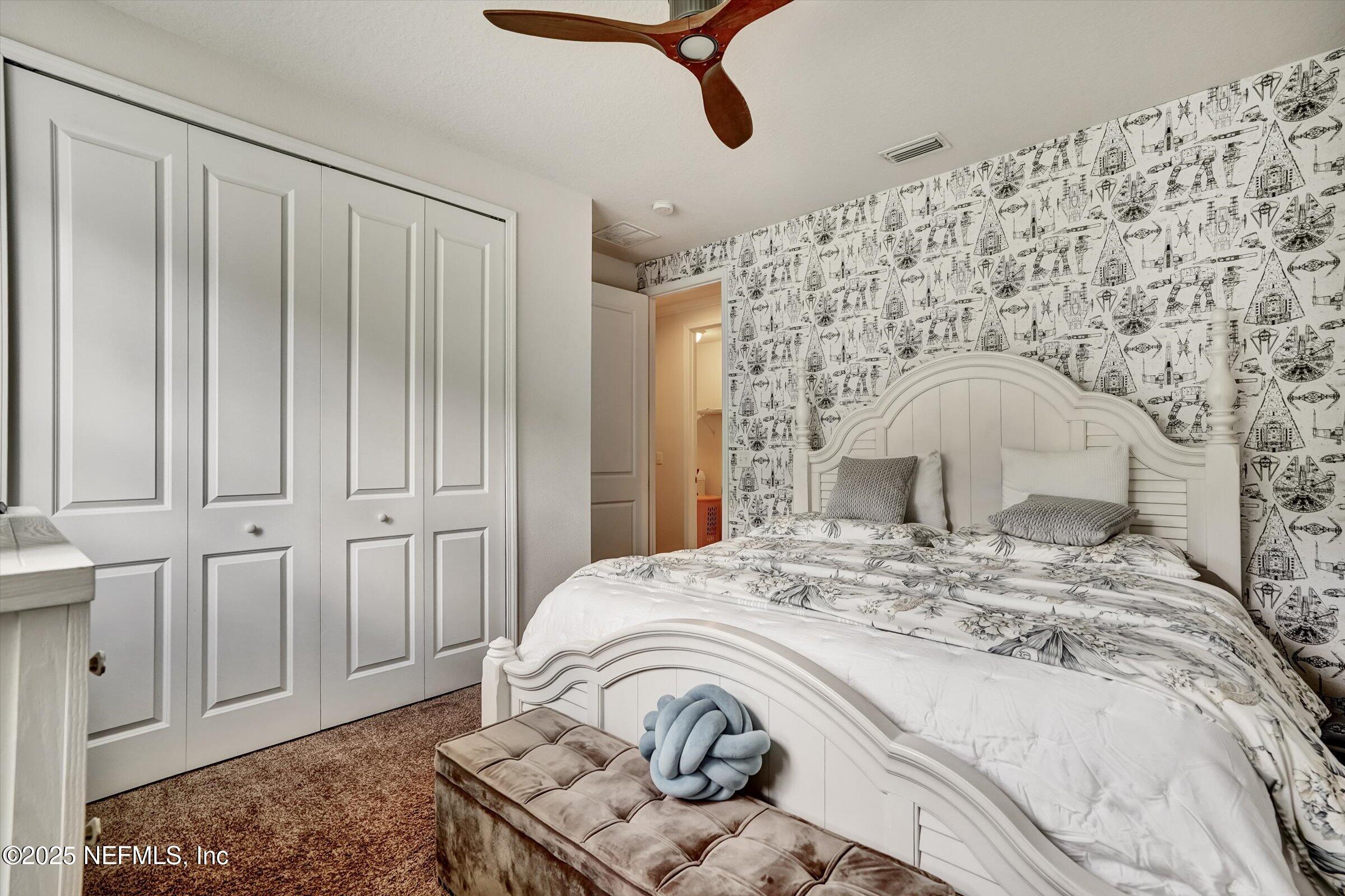 410 Downs Corner Road St. Augustine, FL 32092 - Photo 39 of 45 a bedroom with a bed and a dresser