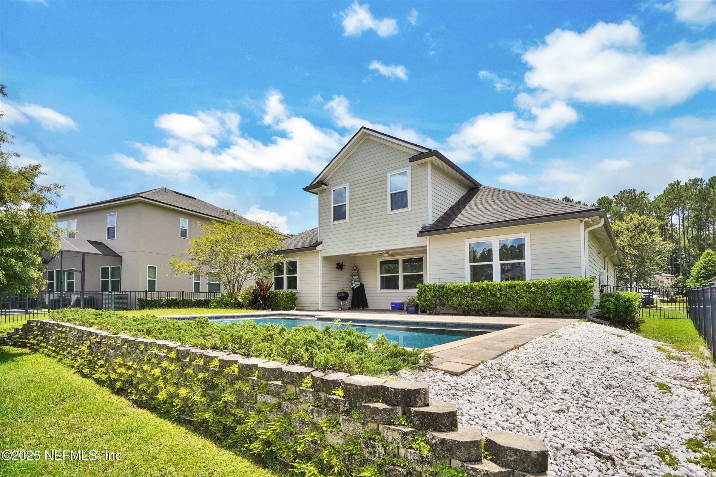 410 Downs Corner Road St. Augustine, FL 32092 - Photo 42 of 45 a front view of house with yard and green space