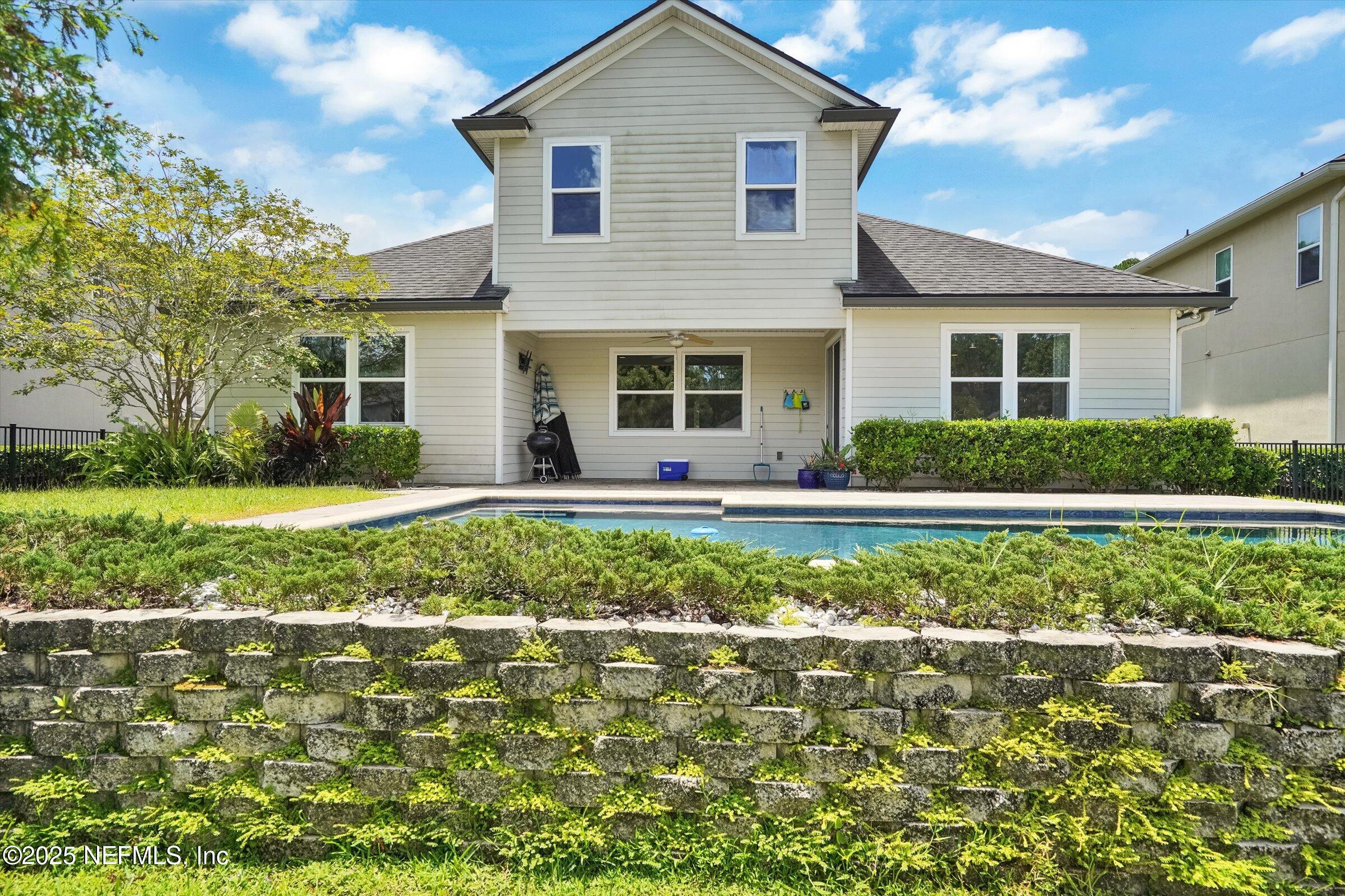 410 Downs Corner Road St. Augustine, FL 32092 - Photo 43 of 45 a front view of a house with a yard