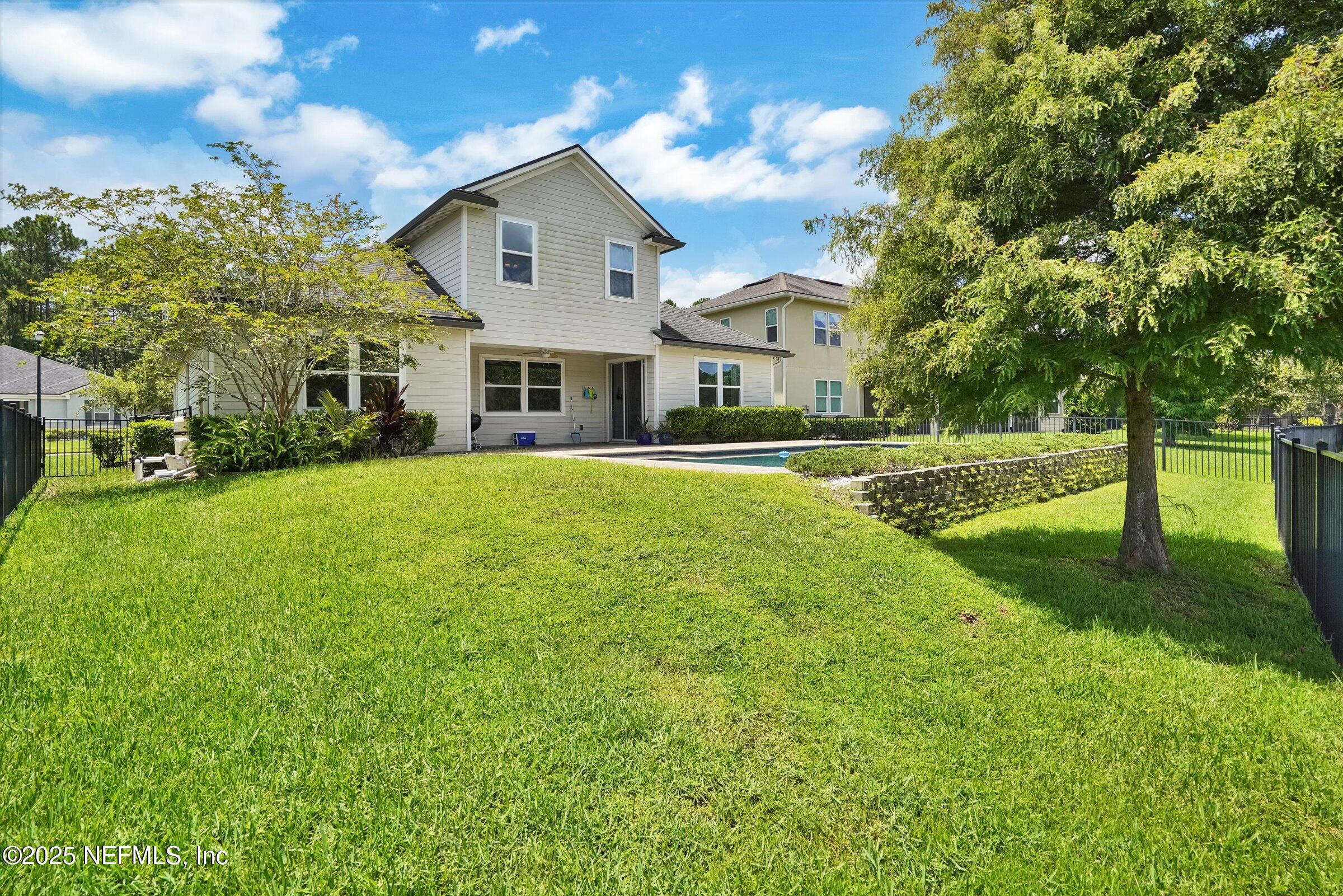410 Downs Corner Road St. Augustine, FL 32092 - Photo 44 of 45 a front view of a house with a yard