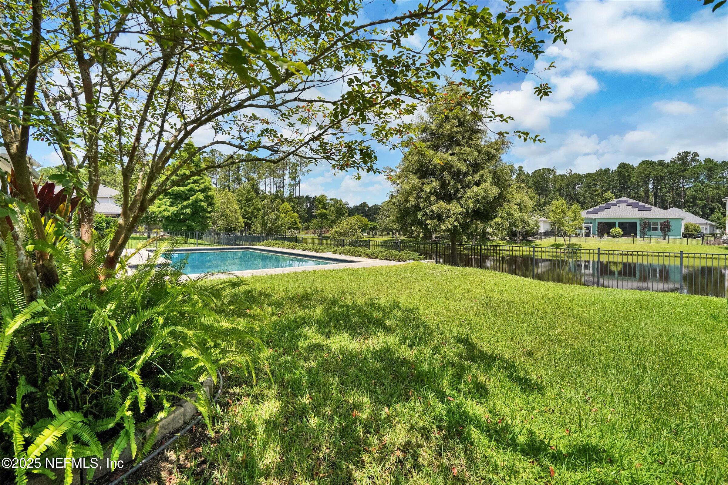 410 Downs Corner Road St. Augustine, FL 32092 - Photo 45 of 45 a view of yard with swimming pool and green space