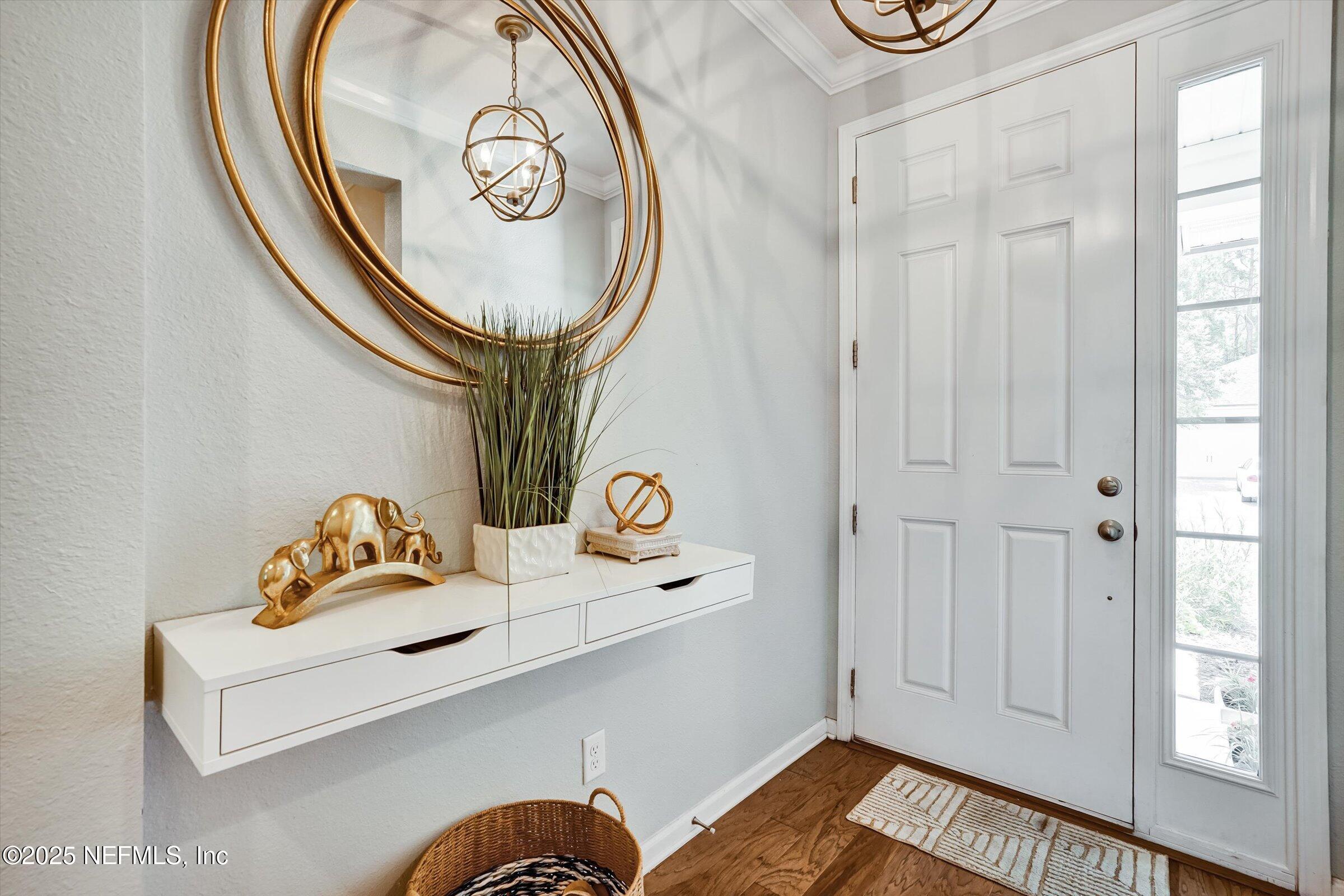 410 Downs Corner Road St. Augustine, FL 32092 - Photo 5 of 45 a bathroom with a sink and a mirror