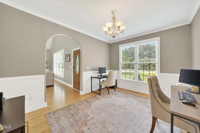 a view of a livingroom with furniture window and wooden floor