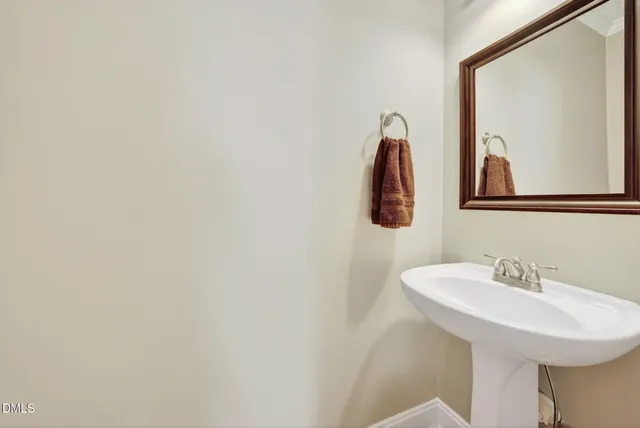 a bathroom with a sink and mirror
