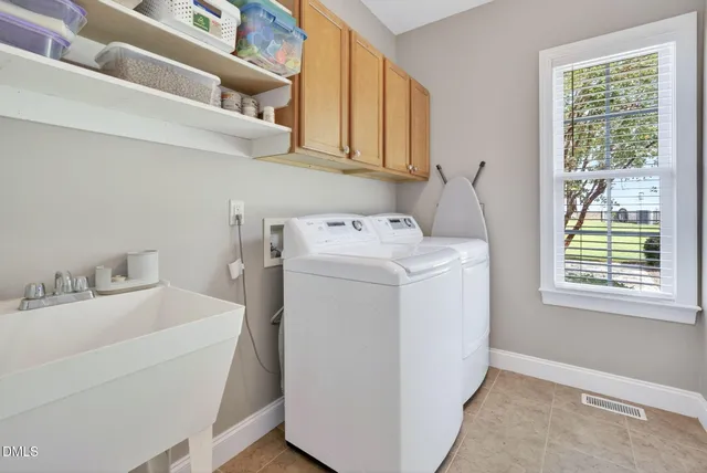 a utility room with dryer and washer