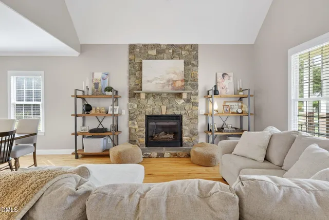 a bedroom with a bed and a fireplace