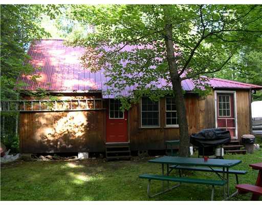 138 Bemis Road Oquossoc, ME 04964 - Photo 11 of 21 Exterior Front. Side of camp