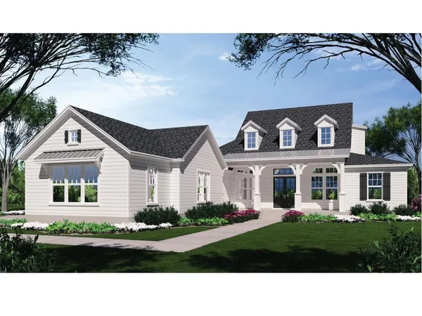 a front view of a house with a garden