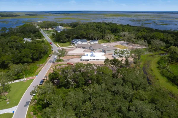 a swimming pool with outdoor seating and yard