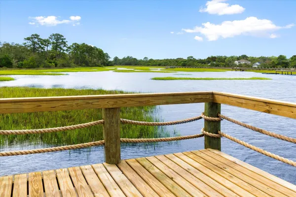 a view of a swimming pool with a yard