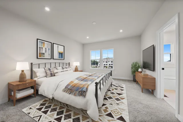 a bedroom with a large bed and a couch