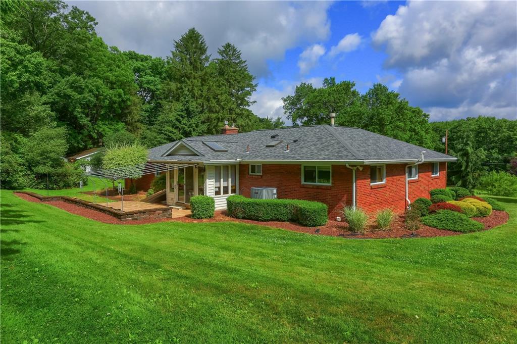 119 Beacon Road Renfrew, PA 16053 - Photo 35 of 49 a front view of a house with garden and trees