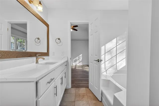 a bathroom with a double vanity sink and mirror