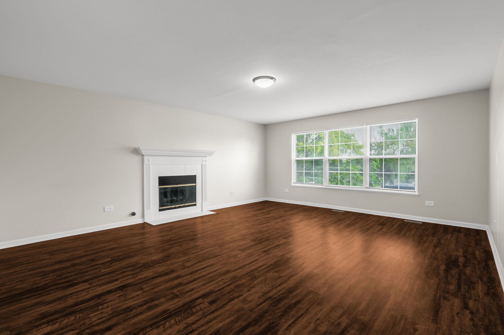 4508 Azalea Avenue Monee, IL 60449 - Photo 12 of 26 a view of an empty room with wooden floor and a window