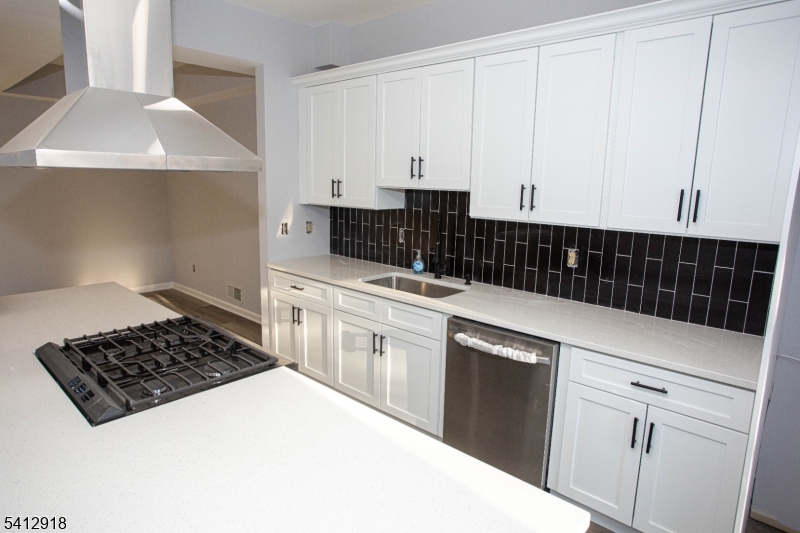 267 Perry Avenue Union, NJ 07083 - Photo 12 of 46 a kitchen with a sink a stove and cabinets