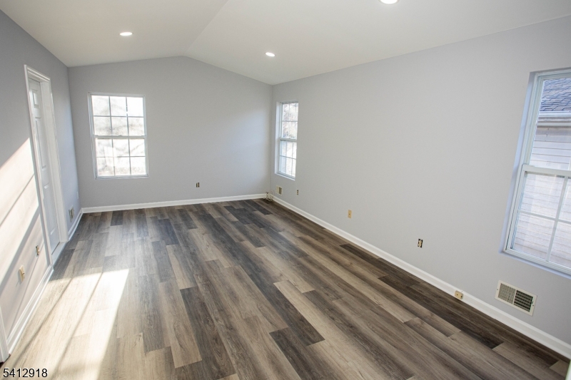 267 Perry Avenue Union, NJ 07083 - Photo 21 of 46 wooden floor in an empty room with a window