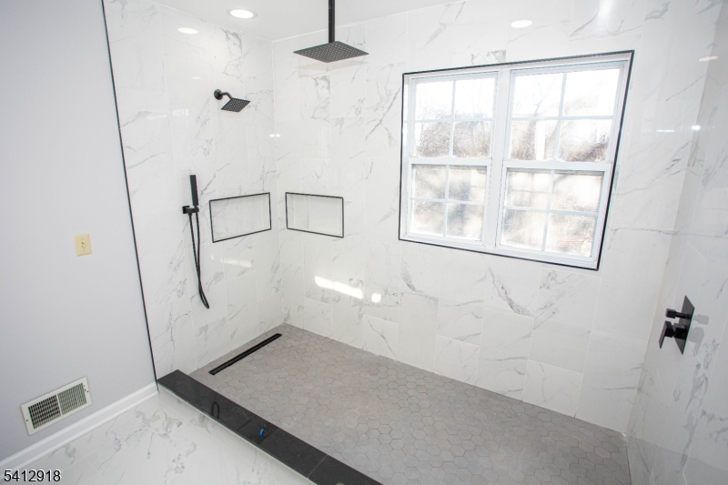 267 Perry Avenue Union, NJ 07083 - Photo 26 of 46 an empty room with windows