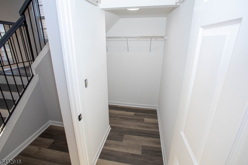 267 Perry Avenue Union, NJ 07083 - Photo 4 of 46 a view of a hallway with wooden floor and entryway