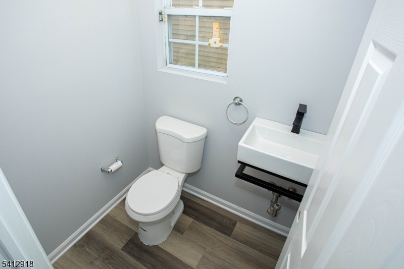267 Perry Avenue Union, NJ 07083 - Photo 5 of 46 a white toilet sitting next to a bathroom sink