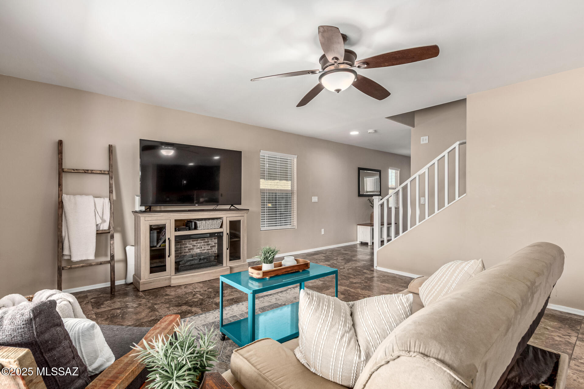 9528 Desert Fauna Loop Tucson, AZ 85747 - Photo 9 of 46 a living room with furniture and a flat screen tv
