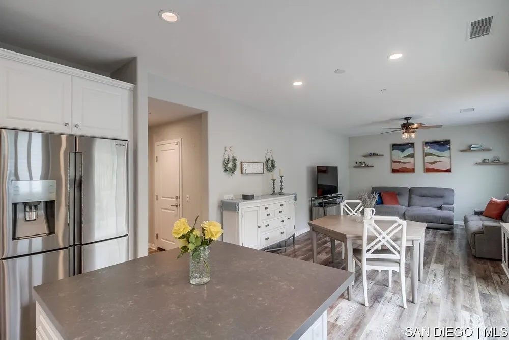 8532 Boulder Way Santee, CA 92071 - Photo 13 of 54 a kitchen with a table and chairs in it