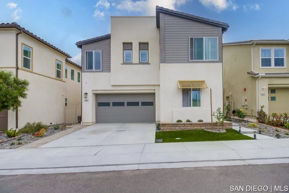 8532 Boulder Way Santee, CA 92071 - Photo 2 of 54 a front view of a house with a yard and garage