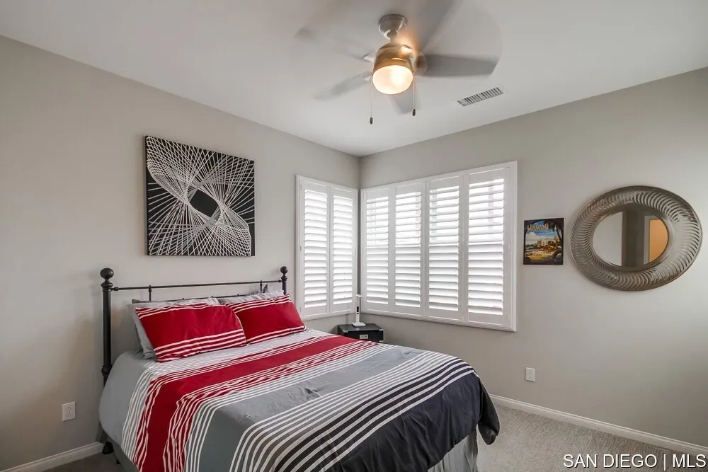 8532 Boulder Way Santee, CA 92071 - Photo 26 of 54 a bedroom with a large bed and a window