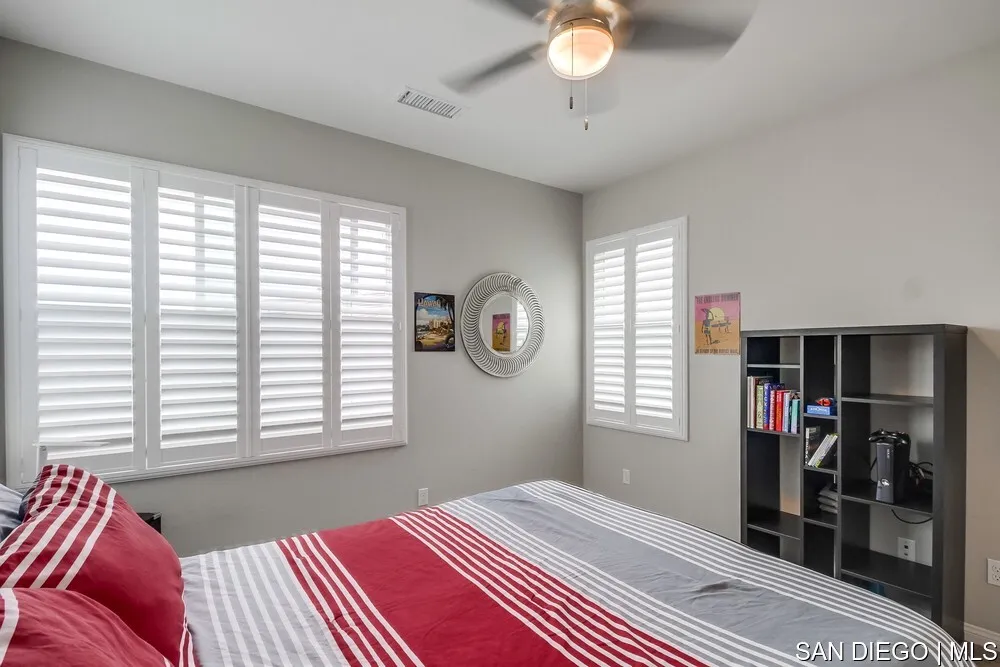 8532 Boulder Way Santee, CA 92071 - Photo 27 of 54 a bedroom with a bed and a window
