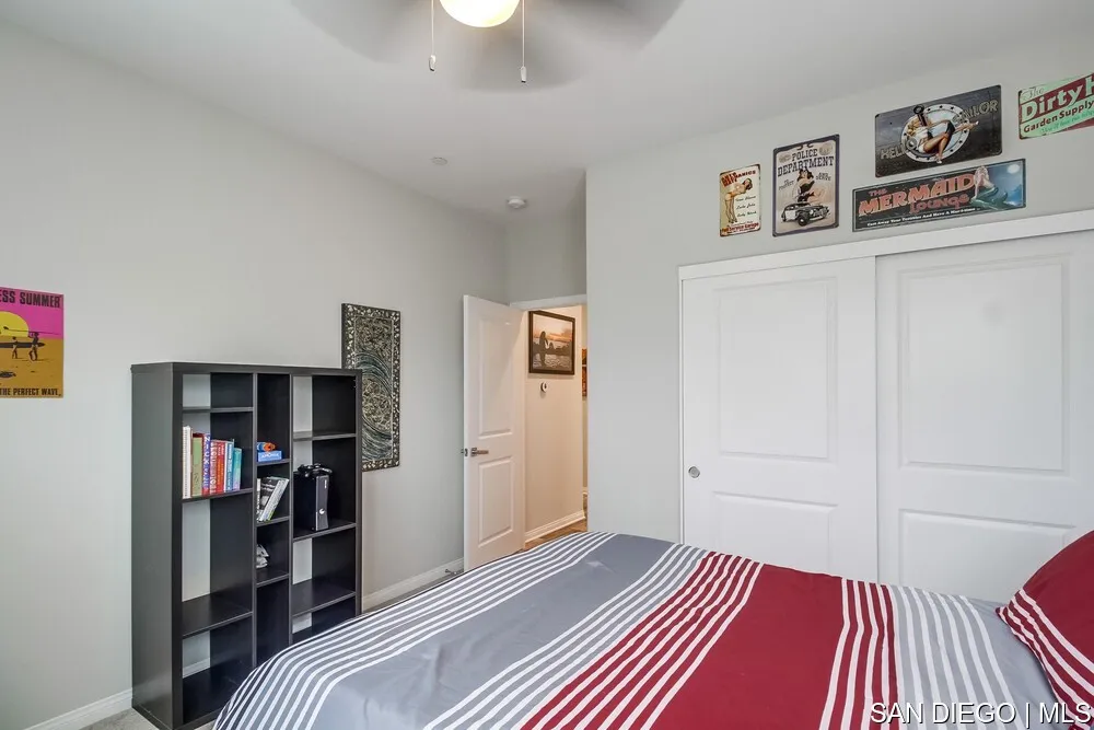 8532 Boulder Way Santee, CA 92071 - Photo 28 of 54 a bedroom with a bed and a walk in closet
