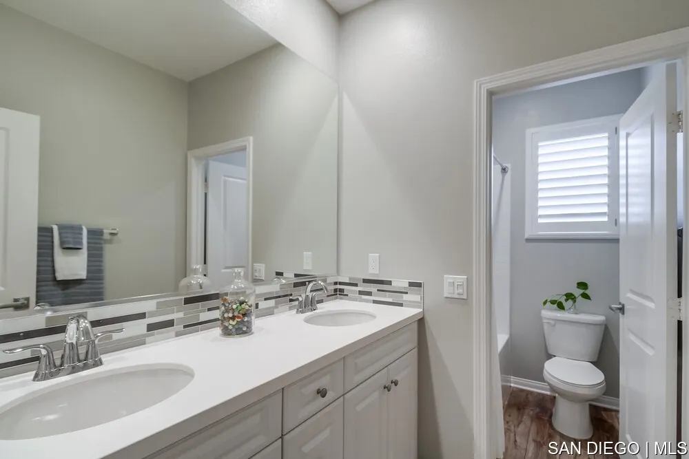 8532 Boulder Way Santee, CA 92071 - Photo 29 of 54 a bathroom with a sink toilet and shower