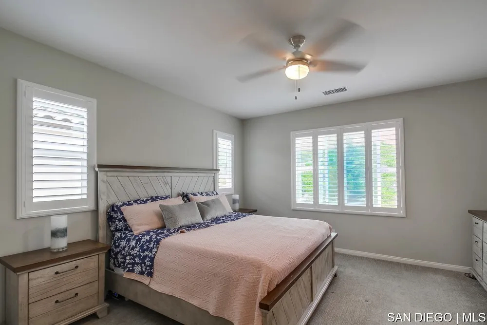 8532 Boulder Way Santee, CA 92071 - Photo 35 of 54 a bedroom with a large bed and a window