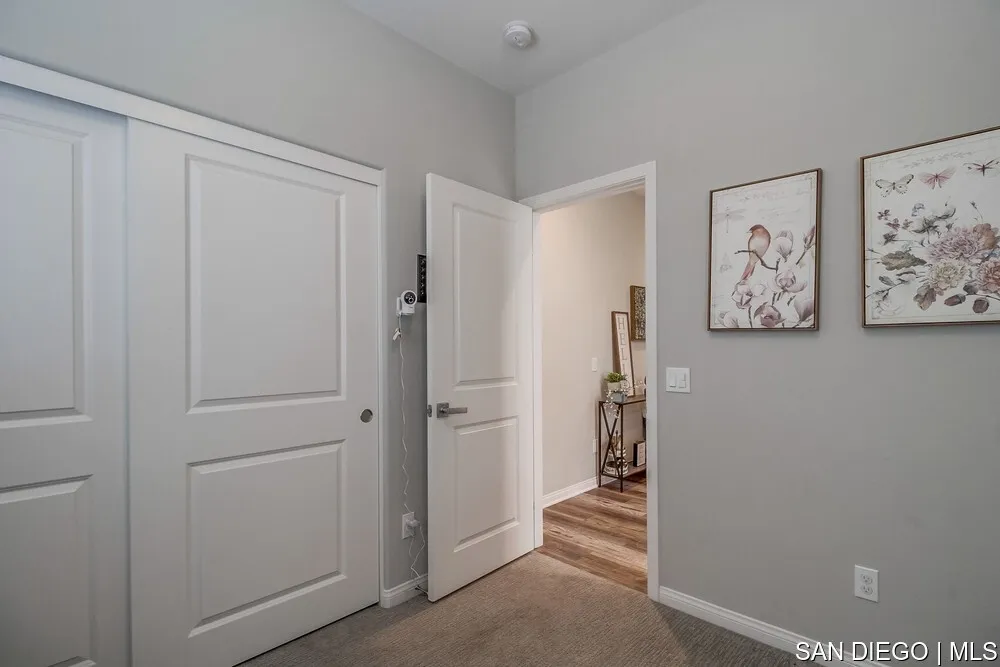 8532 Boulder Way Santee, CA 92071 - Photo 7 of 54 a view of a hallway with closet and furniture