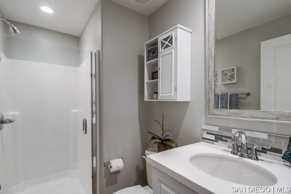 8532 Boulder Way Santee, CA 92071 - Photo 9 of 54 a bathroom with a sink toilet and shower