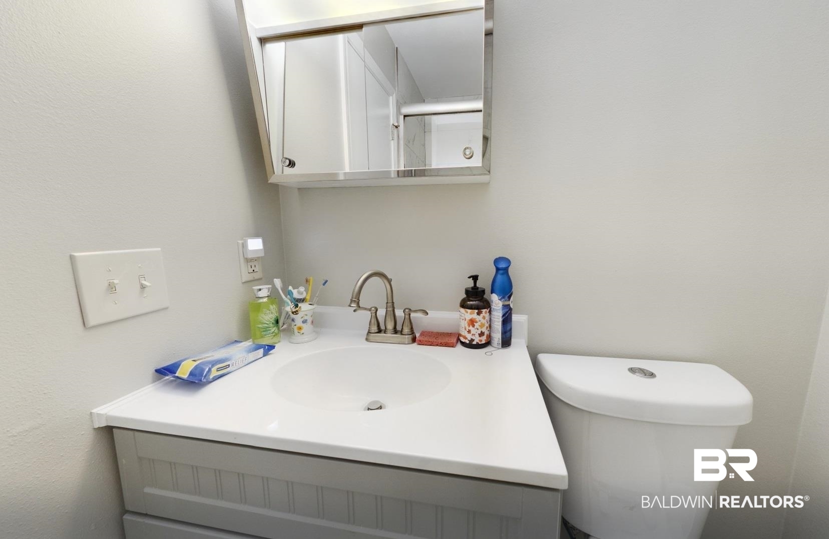 15148 Highland Circle Foley, AL 36535 - Photo 28 of 47 Half bath with vanity and toilet