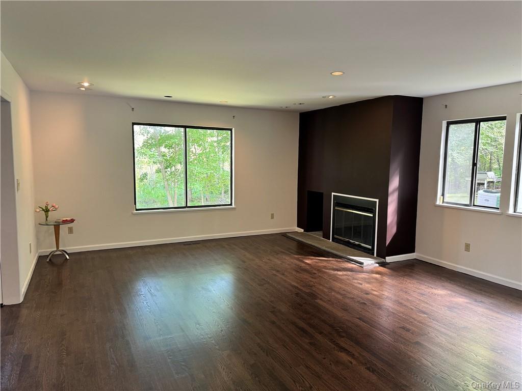 17 Rambling Brook Road Chappaqua, NY 10514 - Photo 8 of 32 Freshly painted with newly installed dark wood floors! Living room offers wood burning fireplace and is adjacent to den/library/home office